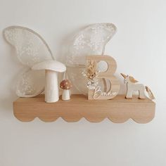 scallop shelf Scallop Shelf Nursery, Girl Nursery Shelf Decor, Toddler Shelf Decor, Baby Girl Nursery Shelf Decor, Scalloped Shelves Nursery, Girls Room Shelves, Boho Butterfly Nursery, Baby Girl Nursery Shelves, Butterfly Nursery Ideas