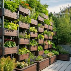 a wooden planter filled with lots of plants