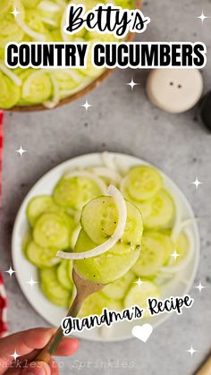 a person is holding a spoon with cucumbers on it