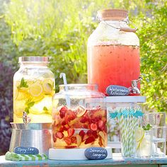 a table topped with jars filled with drinks