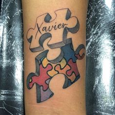 a piece of puzzle tattoo with the word waiver on it's left arm