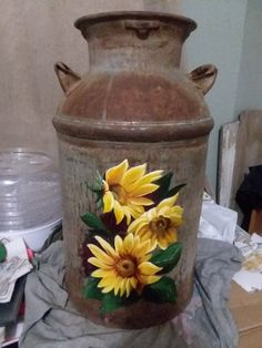 a large vase with flowers painted on it