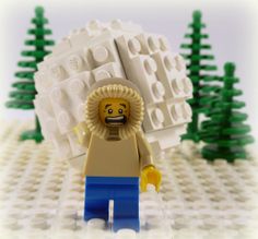 a lego man with a lion's head in front of trees