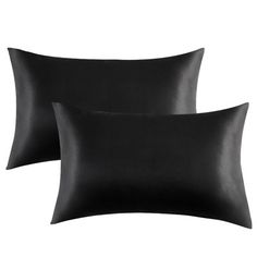 two black pillows sitting next to each other