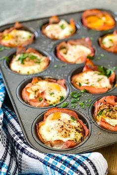 a muffin tin filled with bacon and eggs