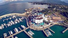 an aerial view of a marina with many boats