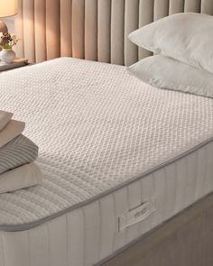 the mattress is made and ready to be used in the bedroom or as a night stand