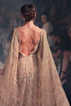 the back of a woman's dress is shown in an instagramtion photo