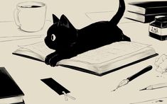 a black cat laying on top of an open book next to a cup of coffee