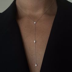 Three 0.25ct diamonds are strung along a 18k gold chain. Diamond shapes from top to bottom are: Round, Marquise, Pear. The collar of the necklace measures 16 inches (40cm); the length of the drop is 4 inches (10cm). To customize, please write to our Atelier. 18k White Gold shown here. Pair with the matching earrings in the Lariat collection. Affordable Adjustable White Long Necklace, Luxury Delicate Long Drop Lariat Necklace, Luxury Women's Lariat Necklace With Delicate Chain, Drop Chain Necklace, Luxury Long Drop Diamond Necklace With Adjustable Chain, Luxury Brilliant Cut Lariat Necklace For Wedding, Luxury Diamond Necklace With Long Drop And Adjustable Chain, Formal Dangle Drop Necklace In Fine Jewelry Style, Formal Drop Dangle Necklace In Fine Jewelry Style