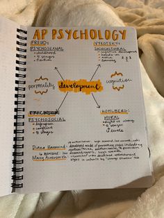 an open notebook with the words ap psychology written in yellow and black ink on it