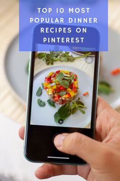 a person holding up a cell phone with the text top 10 most popular dinner recipes on pinterest