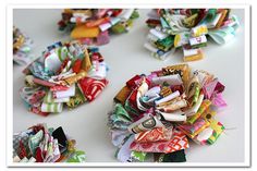 several different types of fabric flowers on a table