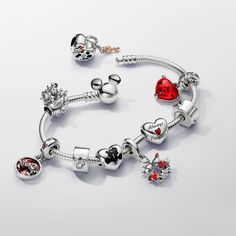 Style your Disney x Pandora charm collection on the Disney Mickey Mouse Clasp Moments Snake Chain Bracelet. This sterling silver snake chain bracelet features a clasp inspired by the iconic Mickey Mouse head silhouette. Press Mickey's ears in opposite directions to easily open and close the clasp. The bracelet has two threaders (raised charm dividers) and can hold 16-18 charms or dangle charms. The perfect way to showcase your Disney favourites. - Pandora Disney Mickey Mouse Clasp Moments Snake Chain Bracelet - Sterling silver - Sz. 6.3 in Charms Pandora Disney, Disney Pandora Bracelet, Charms Disney, Disney Pandora, Disney Moments, Pandora Inspiration, Disney Bracelet, Head Silhouette, Iconic Duo