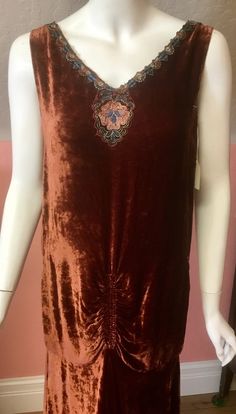 "Gorgeous rusty silk velvet with Art Deco flair. Handkerchief hem with a ruched front adding drama to this flapper dress. Beautiful embroidered applique adorns the front neckline with antique mbroidered Art Deco trim with metallic,blues and orange. Size medium. Measures 36\" bust,28 waist. Length will be posted soon. Excellent condition for its age. Quite strong and wearable." Velvet Bohemian Dress For Holiday Season, Festive Bohemian Velvet Dress, Lame Fabric, Velvet Party Dress, 1920s Dress, Most Beautiful Dresses, Metal Lace, Embroidered Applique, Handkerchief Hem