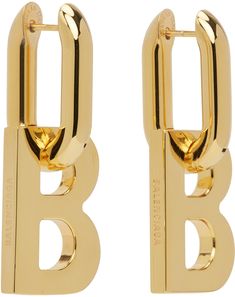 Pair of drop earrings in gold-tone brass. Detachable logo graphic at drop. · Logo engraved at side · Hinged-post fastening · H1 x W0.5 in Supplier color: Gold Balenciaga Ring, Balenciaga Safety Pin Earrings, Balenciaga Earrings, Balenciaga Accessories, Balmain Earrings, Balenciaga Earrings Gold, Balenciaga Gold Bag, Balenciaga Jewelry, Boucheron Jewelry