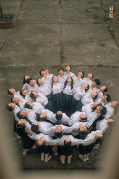 a group of people standing in the middle of a circle