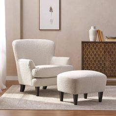 a white chair and ottoman in a living room