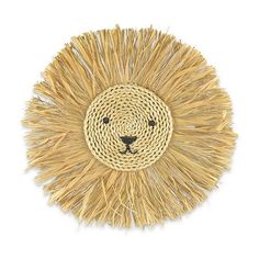 a straw hat with a lion's face on it