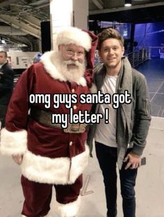 a man standing next to a santa clause with the caption, only guys santa got my