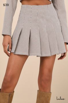 Curate a chic vibe wherever you go in the Lulus Convincingly Poised Brown Plaid Pleated Mini Skirt! Lightweight woven fabric boasts a plaid houndstooth pattern as it shapes this cute skirt that has a high waist and a flaring, pleated design. Mini hem completes the look. Hidden zipper/clasp at side. Pair with the matching skirt for a complete look! Fit: This garment fits true to size. Length: Mid-thigh. Size medium measures 16" from waist to hem. Waist: Fitted - very fitted at natural waist. Hip: Plaid Pleated Mini Skirt, Cute Skirt, Houndstooth Pattern, Brown Plaid, Cute Skirts, Pleated Mini Skirt, Bottom Clothes, Full Skirt, Hidden Zipper