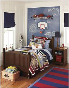 a bed room with a neatly made bed and a basketball court mural on the wall