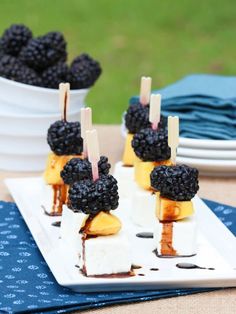 small desserts with blackberries and cheese on sticks