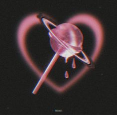 a heart shaped object with a saturn in the middle