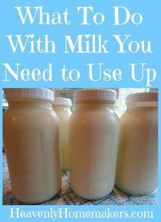 three jars filled with milk sitting on top of a table