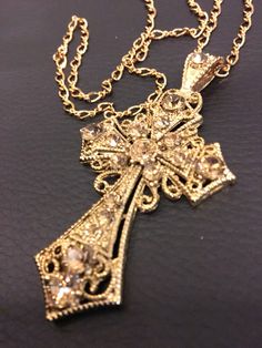 24k antique gold plated cross with champagne colored crystals. Picture does not do justice. I always get compliments when I'm wearing this out. Arte Bob Marley, Golden Arrow, Dope Jewelry Accessories, Jewelry Accessories Ideas, Dope Jewelry, Jewelry Fashion Trends, Jewelry Lookbook, Stacked Jewelry, Expensive Jewelry