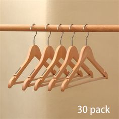 The Solid Wood Clothes Hanger is a versatile household item designed to enhance your wardrobe organization. Crafted for use within wooden closets, this hanger offers a slip-proof and mark-free experience, ensuring your clothes hang comfortably and maintain their shape. Rebrilliant Pack Size: 30 | Rebrilliant Solid Wood Clothes Hanger brownWood in Yellow | 30 | Wayfair | Organization Wood Clothes Hanger, Wardrobe Organization, Wooden Closet, Wardrobe Organisation, Wood Clothes, Storage Closet Organization, Hanging Organizer, Closet Storage, Closet Organization