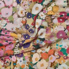 the fabric is colorful and has many flowers on it