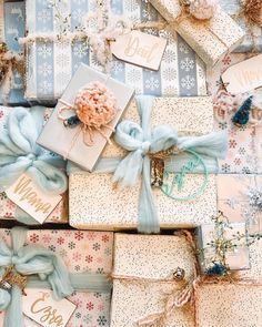 presents wrapped in blue and white paper with bows