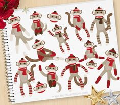 sock monkey stickers on a notebook next to a star and christmas decorations with red flowers in the background