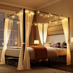 a canopy bed with white drapes and lights on the ceiling, in a bedroom