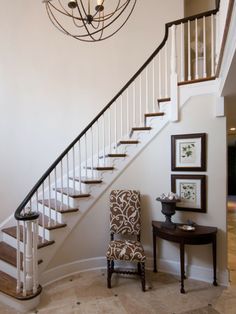 a chair sitting in front of a stair case