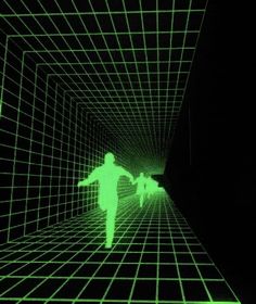 two people are walking through a tunnel with green lines on the walls and in the dark