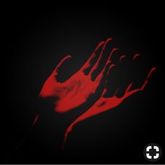 two hands reaching up in the air with red light coming from behind them on a black background