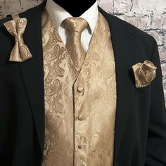 100% Brand new  Men's  Waistcoat Vest & Matching Neck tie & Bow tie and Matching Hanky (4pc Set) Neck tie is not Pre-tied or clip on style, its self tie style Bow Tie is Pre-tied adjustable up to 19.5" Material: 100% Microfiber Two front pocket is for decoration only.  Pocket Square Handkerchief is about: 10" x 10" The Back of the vest is BLACK color. All Vests have an adjustable belted back for a perfect fit. Actual color may differ from the computer monitor display. All the actual measurements Black Suit With Gold Accents, Beige Tuxedo, Gold Tux, Paisley Tuxedo, Champagne Tie, Dark Wedding Theme, Quinceanera Pink, Quinceñera Dresses, Gold Suit