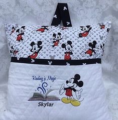 a pillow with mickey mouse on it