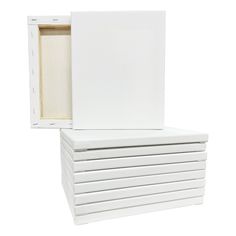 a stack of white boxes sitting on top of each other