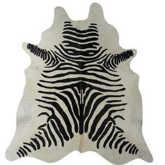 a black and white zebra print area rug on a white background with an animal - like pattern