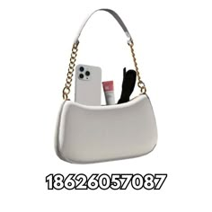 a white purse that has some items in it and is attached to the shoulder strap