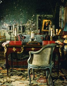 an ornately decorated living room with antique furniture