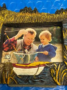 an older man and young boy looking at something in a boat