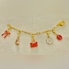 Handmade Paperclip Chain Bracelet With 5 Interchangeable,Detachable Enameled Charms;Paperclip Chain- 7inches;Material-18k Plated Stainless Steel Chain; Charms-Metallic Alloy;This Is Handmade, Expect Imperfections.; Warning: In Order To Extend The Life Of The Charms;Avoid Contact With Perfume, Water, Body Oils And Other Chemicals, Including Household Cleaners. It Should Be Cleaned Gently And Wiped With A Soft Cloth To Remove The Sweat And Dust Remaining On The Charms. Gold-tone Chain Bracelet With Logo Charm As Gift, Gold-tone Bracelet With Logo Charm As Gift, Gold Chain Bracelet With Logo Charm As Gift, Enamel Charms Bracelets For Gift, Yellow Gold Bracelets With Logo Charm For Gifts, Yellow Gold Bracelets With Logo Charm As Gift, Metal Charm Bracelet With Logo For Gift, Metal Charm Bracelet With Logo As Gift, Gold Enamel Bracelets With Charms