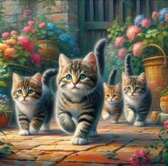 three kittens are walking in front of some flowers