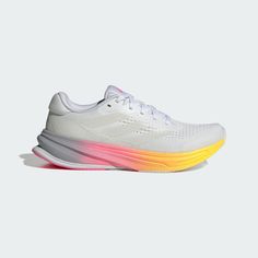 the adidas running shoe in white with multi - colored soles