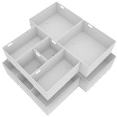 three white drawers stacked on top of each other with one drawer open and the other closed