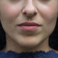 a close up of a woman's face and nose